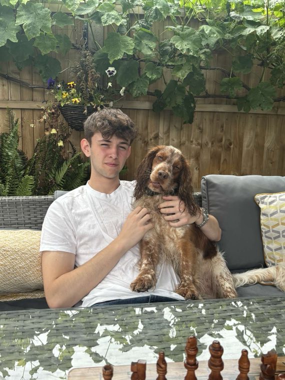 Luke, the founder of Hope AI, with his brown cocker spaniel